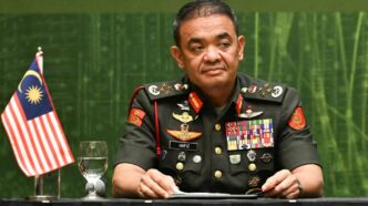 Malaysian Ex-Army Chief, Wife Charged in Corruption Probe