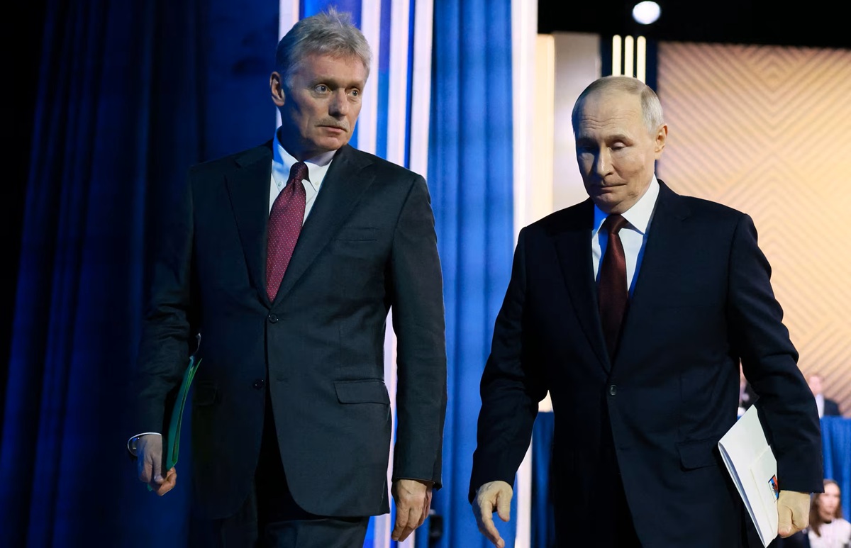 Russian President Vladimir Putin and Kremlin spokesman Dmitry Peskov leave after Putin's annual press conference and phone-in in Moscow,
