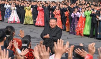 North Korean leader Kim Jong Un greets people during a visit to a coal mine run by young workers to cast his ballot in an election for the Supreme People's Assembly in North Korea, March 15, 2026.