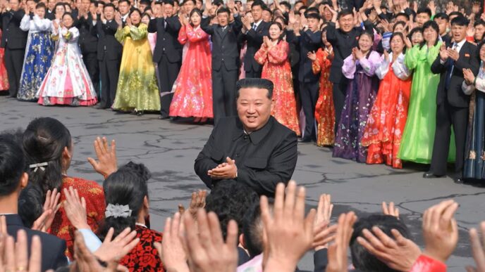 North Korean leader Kim Jong Un greets people during a visit to a coal mine run by young workers to cast his ballot in an election for the Supreme People's Assembly in North Korea, March 15, 2026.