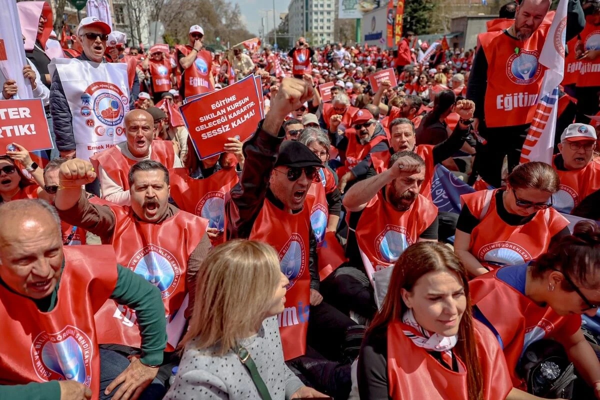 Teachers and members of education unions chant slogans during a protest against school shootings in Ankara on April 16, 2026.