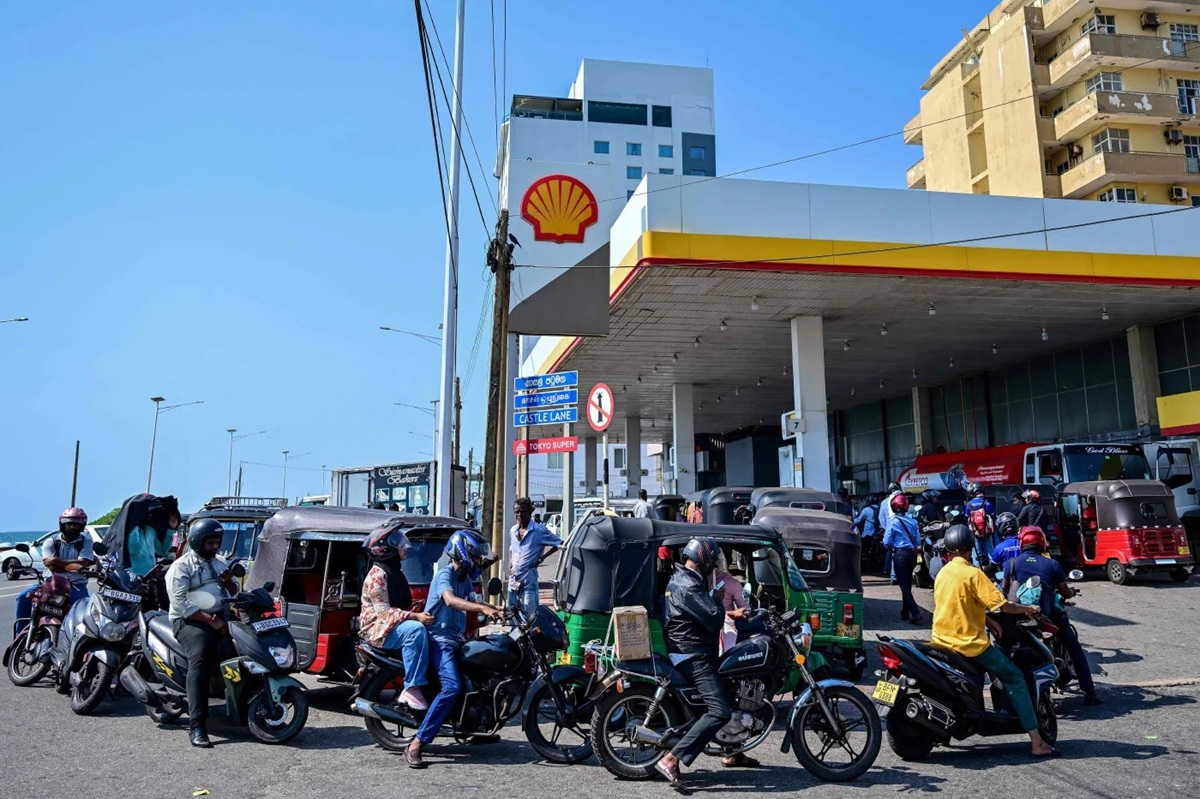 Motorists wait in a queue to refuel their vehicles at a filling station in Wellawatte on the outskirts of Colombo on March 16, 2026.