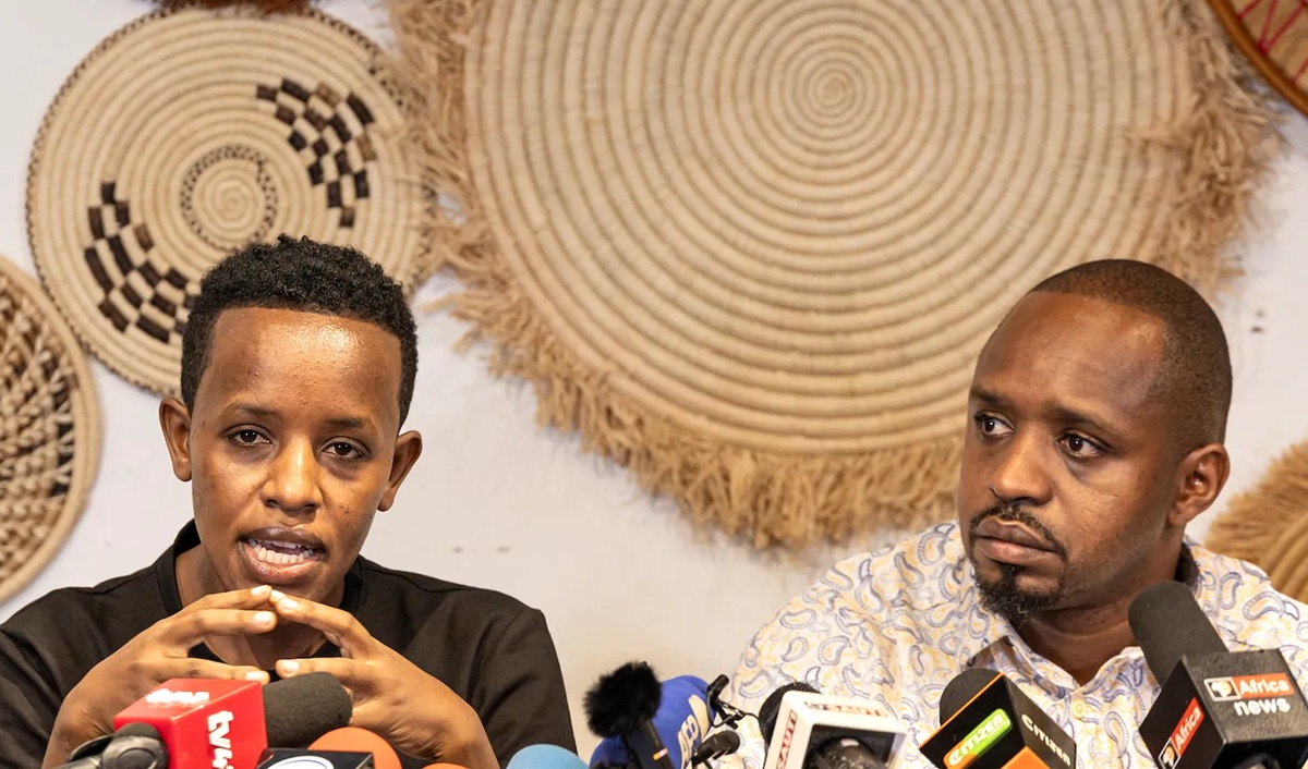 Kenyan activist Boniface Mwangi, right, and Ugandan activist Agather Atuhaire, left, hold a joint press conference following their detention and alleged torture in Tanzania, seen in Nairobi on June 2.
