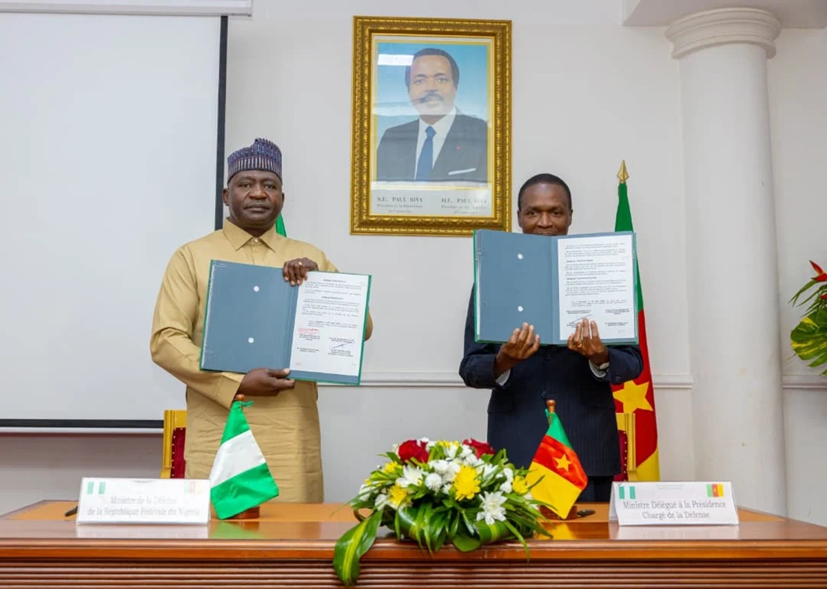 Nigeria's Minister of Defence, General Christopher Musa (retd), and Cameroon's Minister Delegate at the Presidency in Charge of Defence, Mr Joseph Assomo, after signing the MoU.