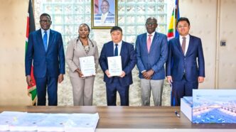 (From Left) Transport CS Davis Chirchir, Aviation and Aerospace Development PS Teresia Mbaika, CRBC General Manager Yu Xiaodong and other officials at the signing of the JKIA expansion deal on June 23, 2026. Credit: Citizen Digital.