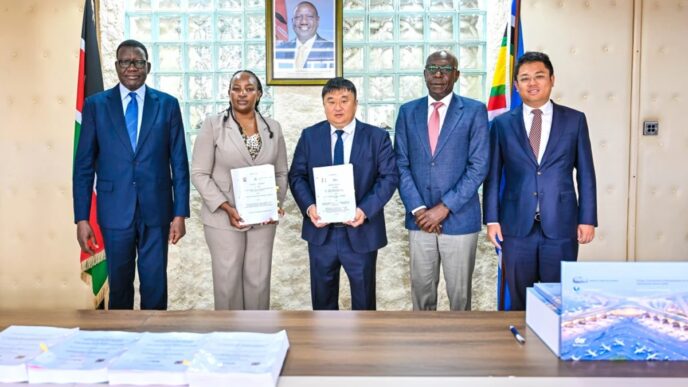 (From Left) Transport CS Davis Chirchir, Aviation and Aerospace Development PS Teresia Mbaika, CRBC General Manager Yu Xiaodong and other officials at the signing of the JKIA expansion deal on June 23, 2026. Credit: Citizen Digital.