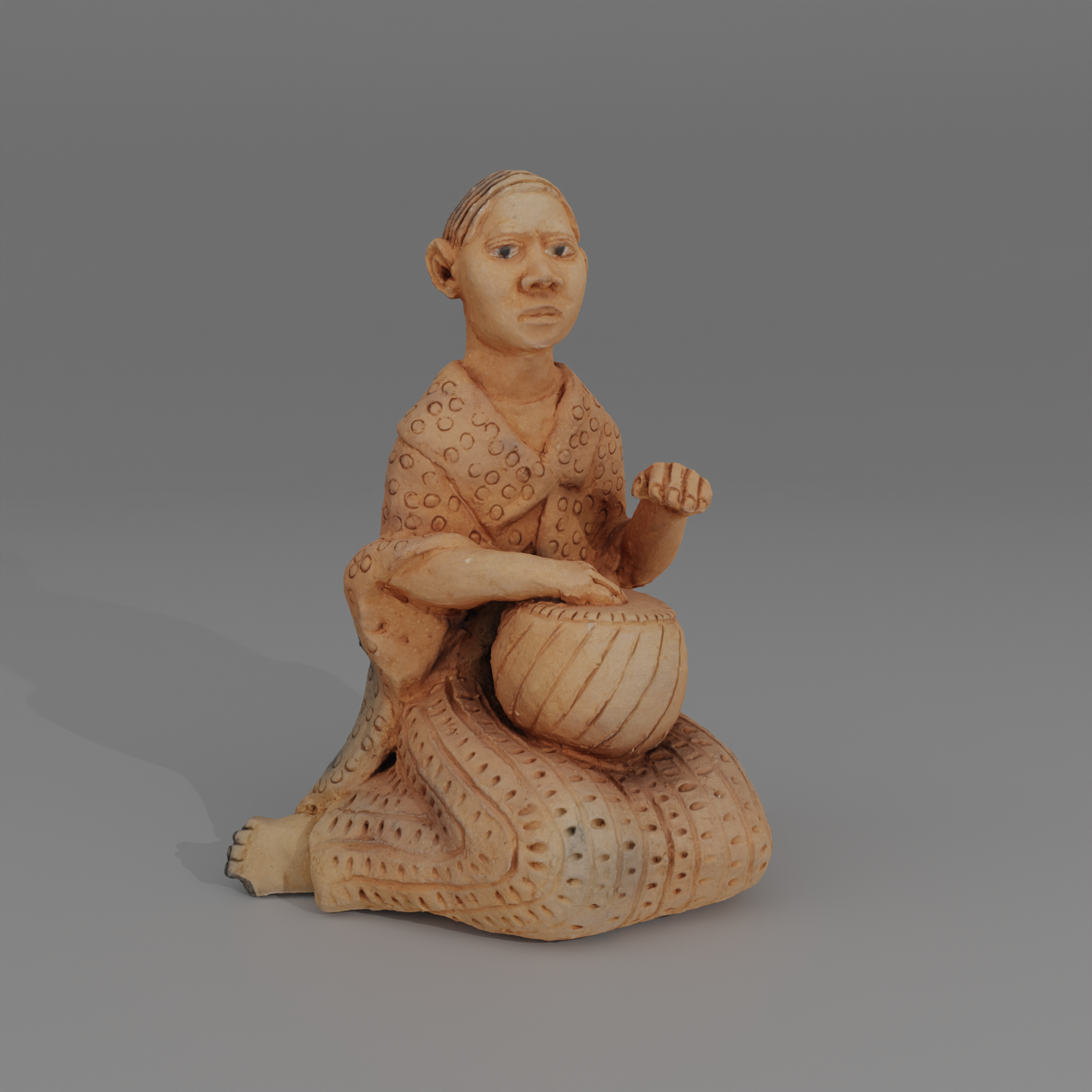 Clay figurine of seated woman with a drum