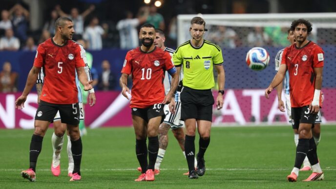 Egypt's defender #05 Ramy Rabia, forward #10 Mohamed Salah and defender #03 Mohamed Hany react during the 2026 World Cup round of 16 football match between Argentina and Egypt at Atlanta Stadium in Atlanta on July 7, 2026. (Photo by Odd ANDERSEN / AFP)