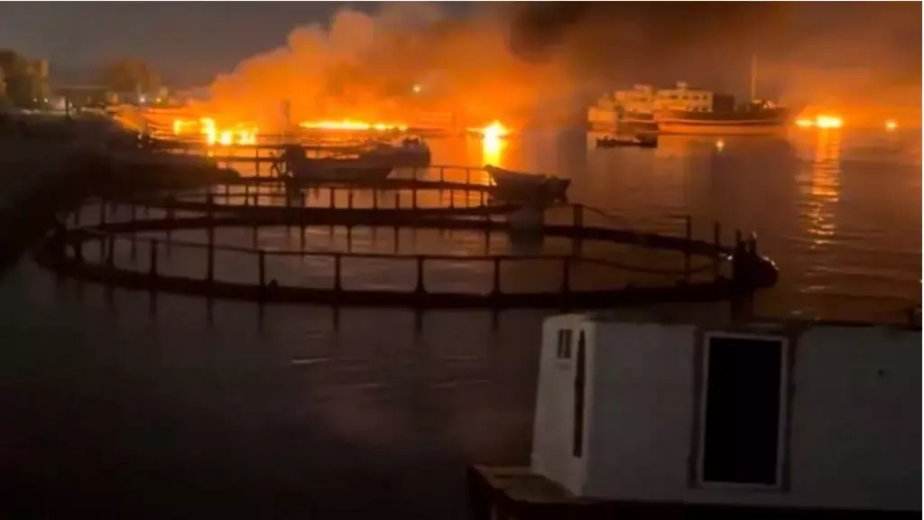 Smoke rises from a port near the Strait of Hormuz following US strikes on Kuhestak in Iran's Hormozgan Province on July 8, 2026.