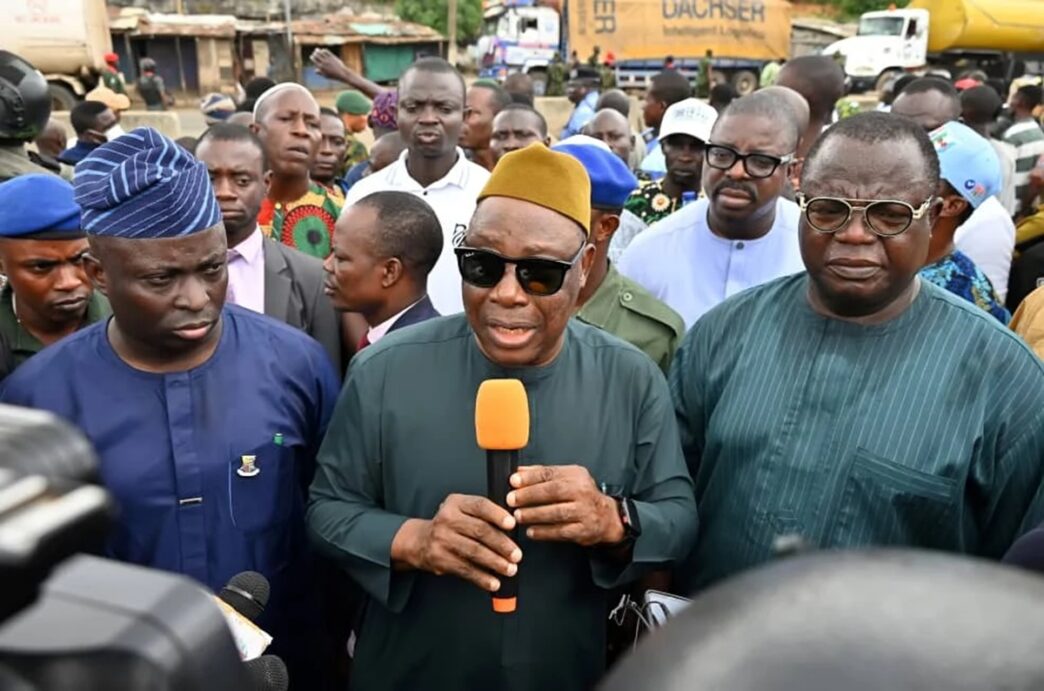 The Oyo State Deputy Governor, Bayo Lawal (m) with other government functionaries while addressing Ojoo residents, especially youths during an on the spot assessment after the clash in Ibadan.