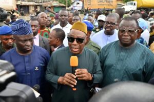 The Oyo State Deputy Governor, Bayo Lawal (m) with other government functionaries while addressing Ojoo residents, especially youths during an on the spot assessment after the clash in Ibadan.