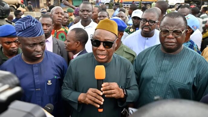 The Oyo State Deputy Governor, Bayo Lawal (m) with other government functionaries while addressing Ojoo residents, especially youths during an on the spot assessment after the clash in Ibadan.