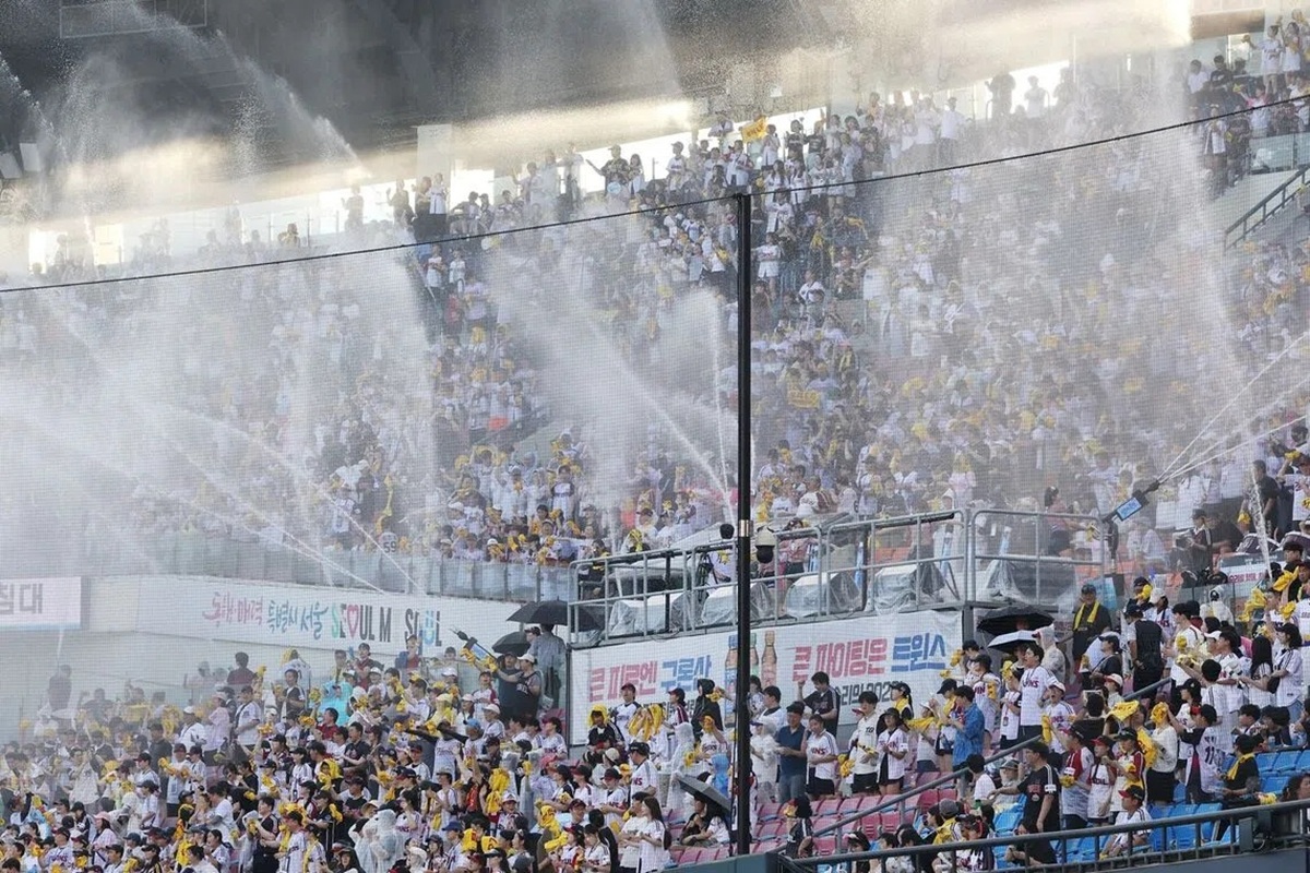 Water cannon being sprayed into the stands to cool off spectators during a South Korean professional baseball game on July 29.