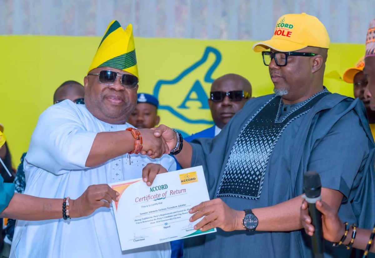 Accord National Chairman Maxwell Mgbudem, handing over the certificate of return to Osun State Governor Ademola Adeleke.