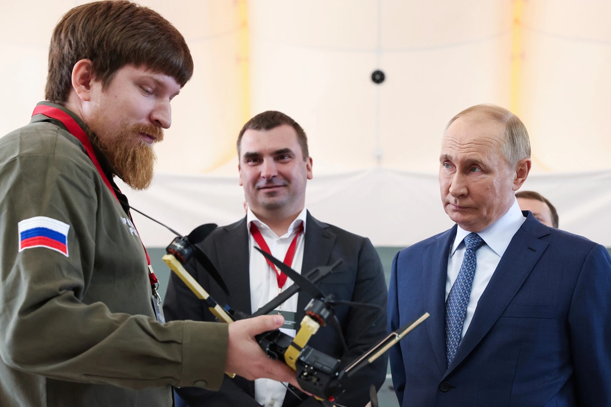 Russian President Vladimir Putin, right, speaks with Vladimir Tkachuk, the head of the Uraldronzavod, during his visit to the Special Technology Centre in St. Petersburg, Russia. Credit: AP News.