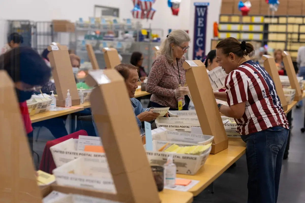 Election workers extract mail-in ballots at the registrar of voters’ office during the California primary election in San Diego, California, June 2, 2026. REUTERS/Mike Blake