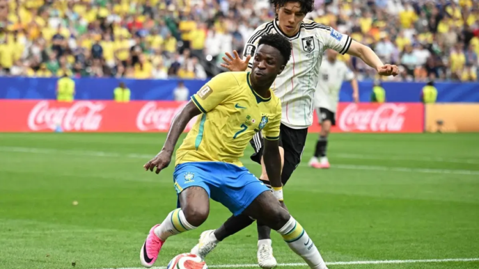 Brazil's Vinicius Jr (in yellow) in action against Japan's Ao Tanaka during their World Cup clash on June 29. Brazil won the match 2-1. PHOTO: REUTERS