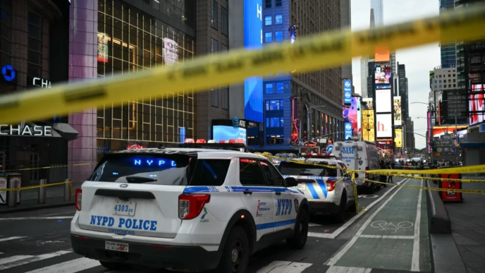 New York City Police vehicles are seen in the area where an officer-involved shooting left one dead near Times Square, in New York, on August 31, 2026.