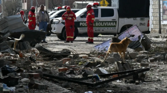 Firefighters check damages following an explosion at an army barracks the night before, in Viacha, Bolivia, on September 5, 2026.