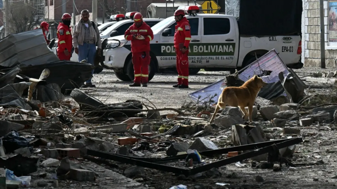 Firefighters check damages following an explosion at an army barracks the night before, in Viacha, Bolivia, on September 5, 2026.