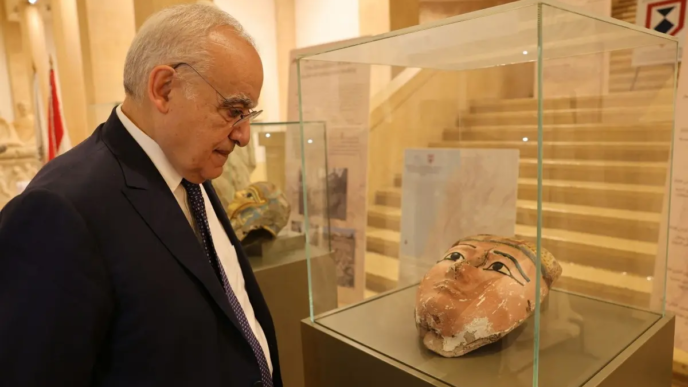 Lebanon's Minister of Culture Ghassan Salameh inspects illegally smuggled artifacts that date back to the Egyptian pharaonic era at the National Museum of Beirut on September 16, 2026, during a ceremony held to mark their handover back to Egypt.