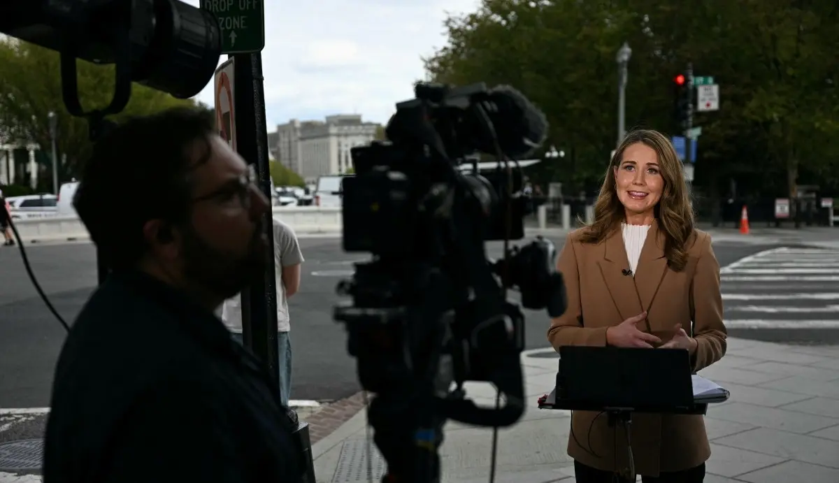 CNN reporter Julia Benbrook gives a live report near the White House in Washington, DC, on September 19, 2026.