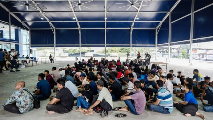 Rohingya refugees are seen at the Kuala Lumpur Police Headquarters after being relocated from outside the UNHCR office in Jalan Bukit Petaling on July 28, 2026, ahead of their repatriation to Myanmar, from where they originally fled.
