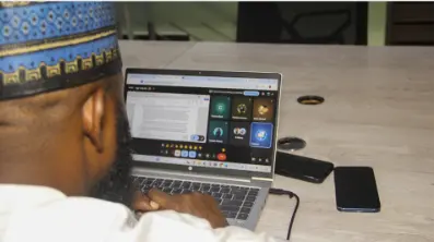 Idris Abba, a chartered accountant and lecturer at Abuja's Santuval Academy demonstrating how Distinction AI works