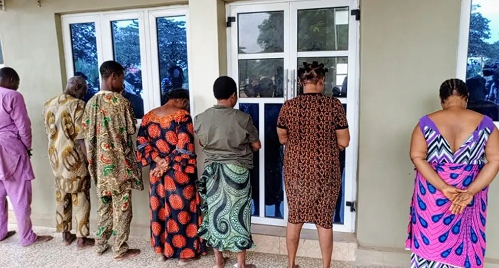 The suspects being paraded by the police.