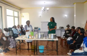 Teresa Njoroge, CEO and Co-founder of Clean Start Africa, watching as post-incarnated women are being trained on yoghurt making at Clean Start Offices