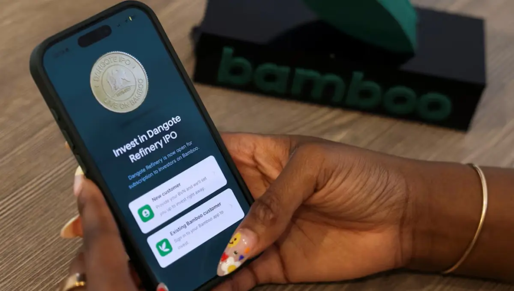 ]A person uses the Bamboo mobile application, after the opening of Dangote Refinery's initial public offering (IPO) at the Nigerian Exchange Group (NGX Group), in Lagos, Nigeria, September 16, 2026. REUTERS