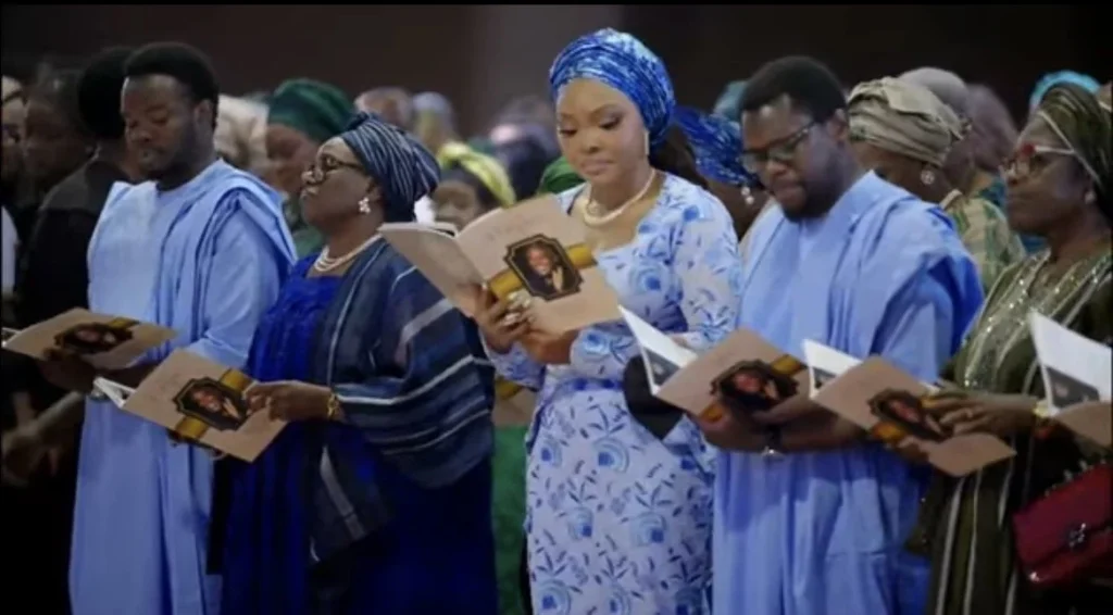 Actress Joke Silva and her sons at the funeral mass