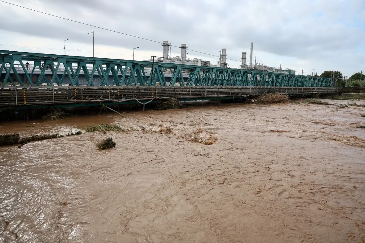 The swollen Besos River flows through Sant Adria de Besos following torrential rains on the outskirts of Barcelona, on October 4, 2026.