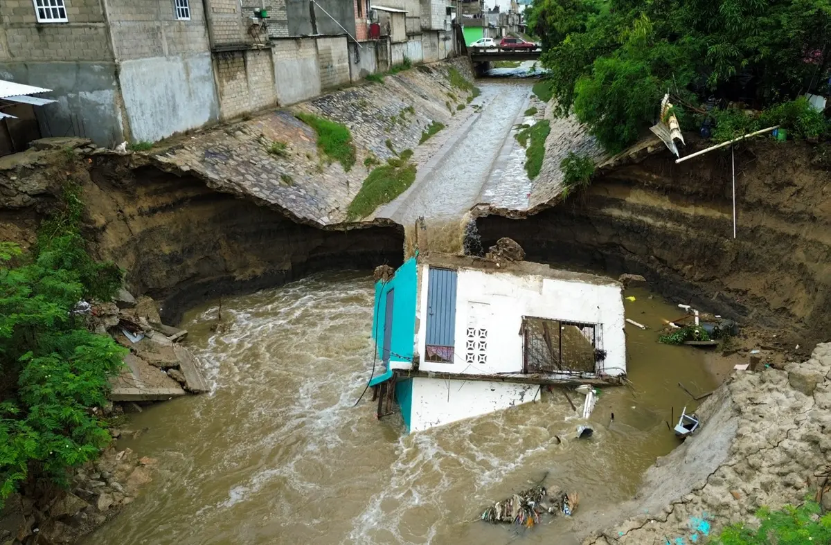 This aerial view shows a house swept away by heavy rains ahead of the arrival of Hurricane Simon in Acapulco, Guerrero state, Mexico, on October 10, 2026.