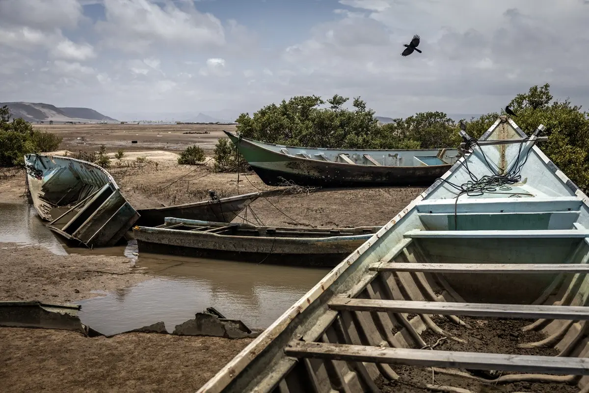 Boats seized from smugglers attempting to transport migrants to Yemen are stored at a Coast Guard post in Khor Angar, on April 12, 2026.