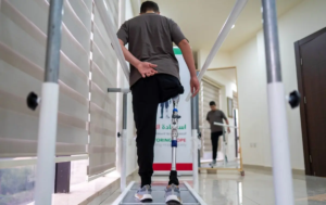 Zuhdi Abou Shanab, a 17-year-old Palestinian boy who lost his entire right leg below the hip during the war in Gaza, undergoes rehabilitation treatment with his prosthetic at a medical centre in Amman on October 13, 2026 as part of the "Jordanian medical corridor" initiative.