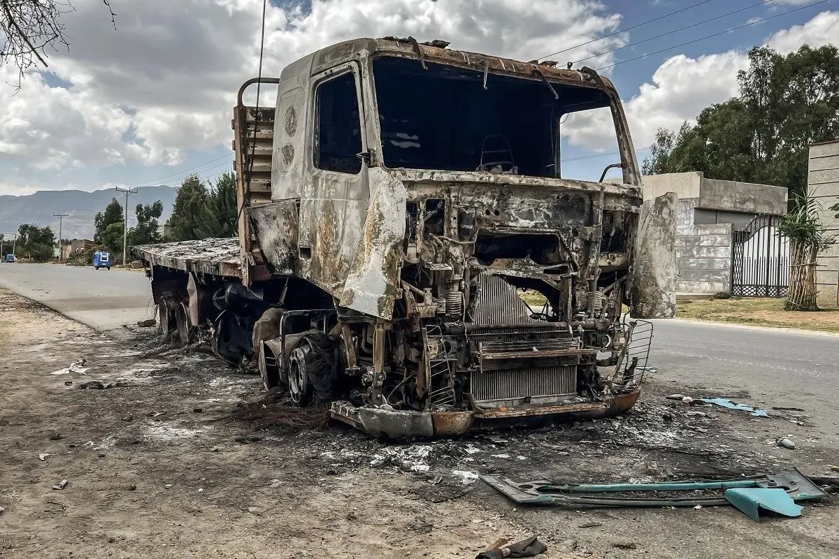 A truck belonging to the Tigray People's Liberation Front (TPLF) stands burned along a road following clashes between Ethiopian federal forces and armed groups opposed to the government in Adigrat on October 17, 2026.