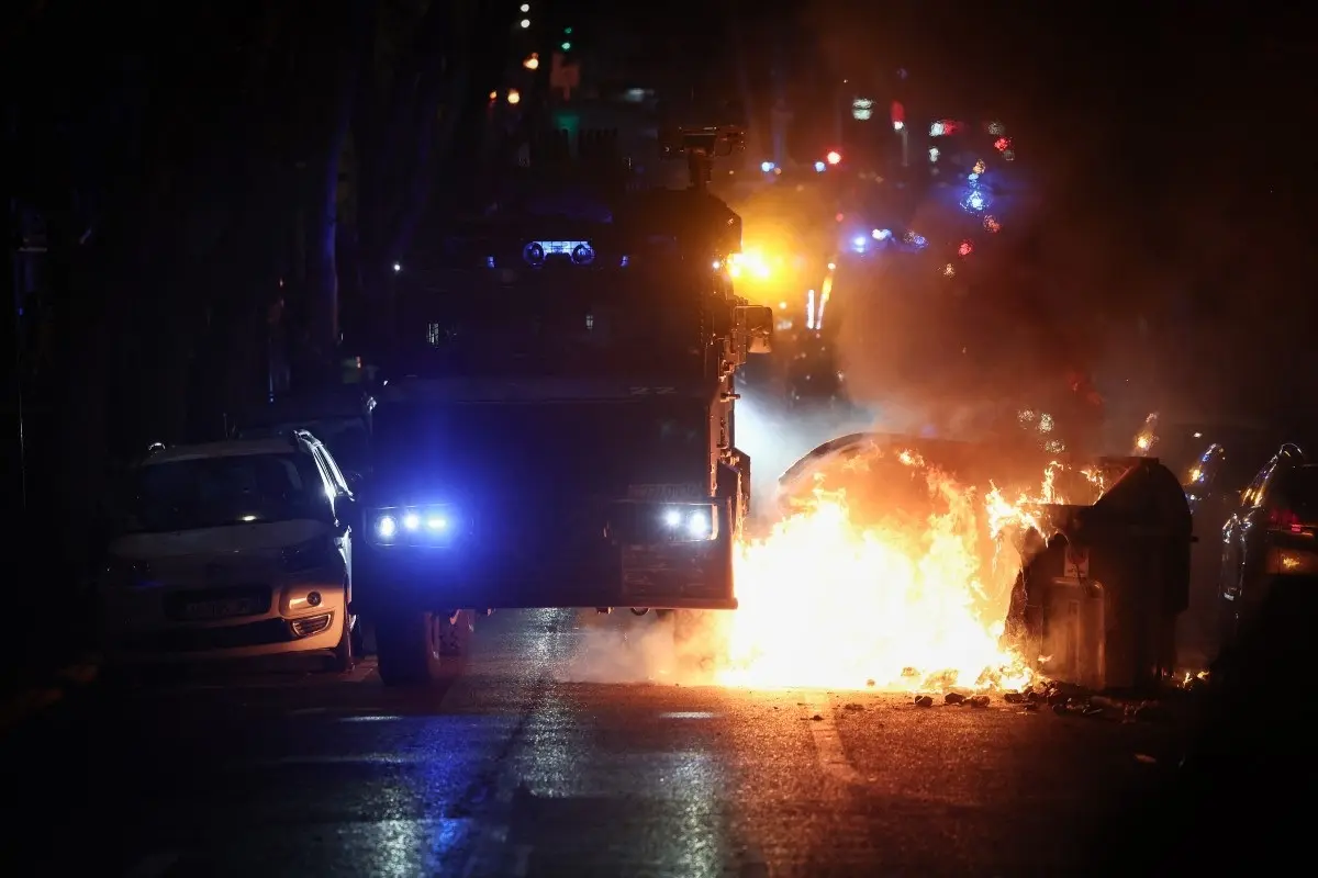 A French gendarmerie "Centaure" multipurpose intervention vehicle (VIPG) drives through a burning barricade during a demonstration in favor of purchasing power, the protection of public services, and fiscal and social justice, in Marseille, southeastern France on October 24, 2026