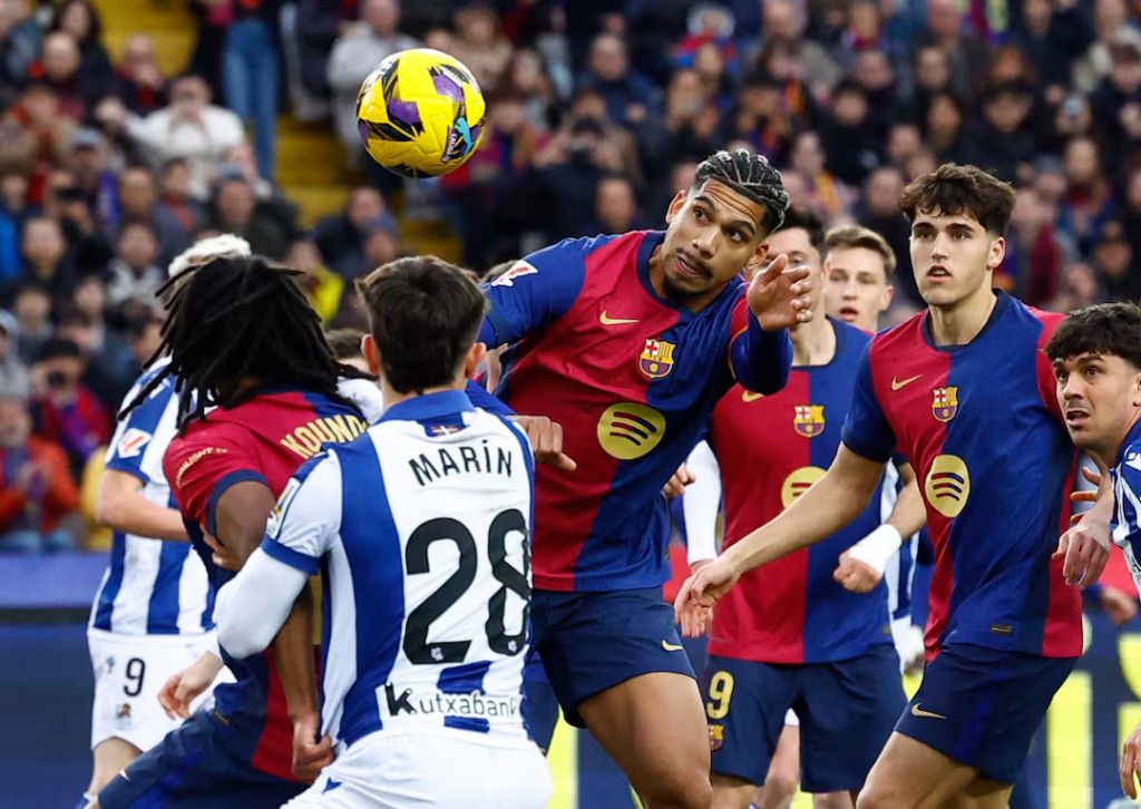 Barcelona Dominate 10-Man Real Sociedad with 4-0 Victory to Regain Lead