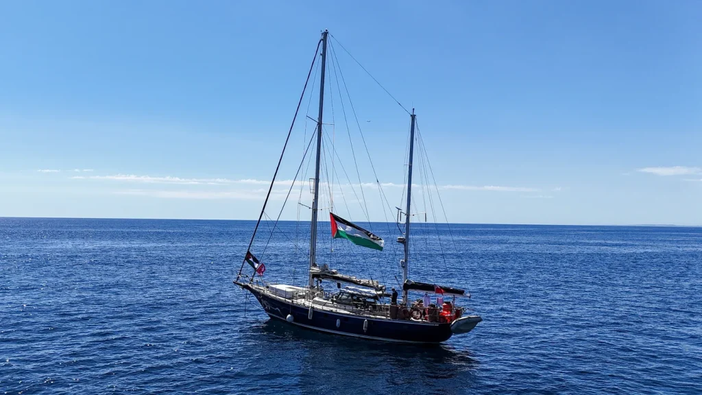 * Gaza Aid Boat Activists Denounce Israel’s Threat to Attack Vessel