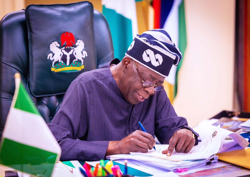 ambassadors_President Tinubu-signing-documents