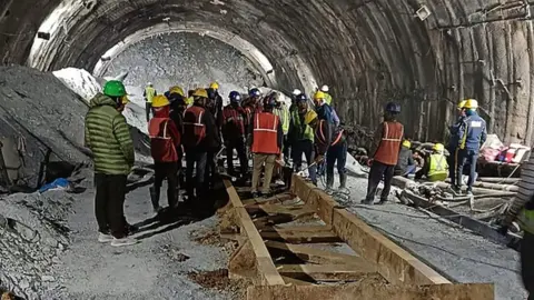 Rescuers Race to Save Eight Workers Trapped in India Tunnel Collapse